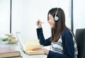 Young female long hair sitting in living room and learning online Royalty Free Stock Photo