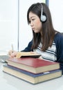 Young female long hair sitting in living room and learning online Royalty Free Stock Photo