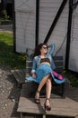 Young female lying on bench with sunglasses Royalty Free Stock Photo