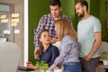 Young female manager having a conversation with her team in the office Royalty Free Stock Photo