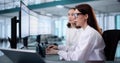 young female medical coder maintaining billing spreadsheets