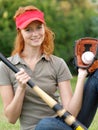 Young female with mitt, ball and bat. Royalty Free Stock Photo