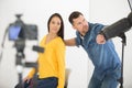 young female model being photographed in studio by photographer Royalty Free Stock Photo