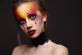 Young female model with bloody eyes makeup