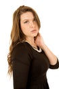 Young female model wearing black dress serious expression Royalty Free Stock Photo