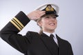 Young female naval officer saluting