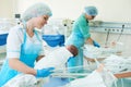 Young female nurse holding a newborn baby in hospital