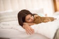 Female owner sleep with puppy pet