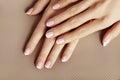 Young Female Palm. Beautiful Glamour Manicure. French Style. Nail polish. Care about Hands and Nails, clean Skin