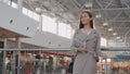 Young female passenger at the airport using her tablet computer while waiting for flight Royalty Free Stock Photo