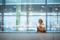 Young female passenger at the airport, using her tablet computer Royalty Free Stock Photo