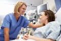Young Female Patient Talking To Nurse In Emergency Room Royalty Free Stock Photo
