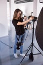 Young female photographer work in studio Royalty Free Stock Photo