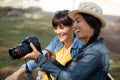 young female photographers watching photos on new slr camera Royalty Free Stock Photo