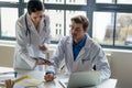 Young female physician asking for advice from her experienced colleague Royalty Free Stock Photo