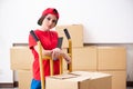 The young female professional mover doing home relocation Royalty Free Stock Photo