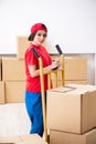 The young female professional mover doing home relocation Royalty Free Stock Photo