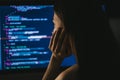 Young female programmer writes program code on a computer. Royalty Free Stock Photo