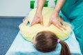 Young female receiving massage from therapist. A chiropractor stretching his patient`s spine in medical office. Neurological phys Royalty Free Stock Photo