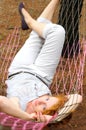 Young female relaxing in hammock Royalty Free Stock Photo