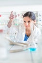 Young, female researcher carrying out experiments in a lab Royalty Free Stock Photo