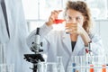 Young female researcher working in modern biological laboratory