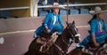 Female rider dressed in blue