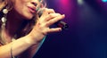 Young female rockstar Singing in Concert Royalty Free Stock Photo