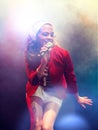 Young female rockstar Singing in Concert Royalty Free Stock Photo