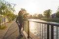 Attractive young woman stretching her legs before her early morning exercise Royalty Free Stock Photo