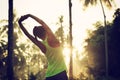 Runner warming up before running at morning forest trail Royalty Free Stock Photo