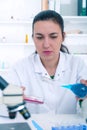 Young Female Scientist Analyzing Sample In Laboratory.laboratory assistant analyzing a sample. Royalty Free Stock Photo