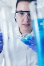 Young Female Scientist Analyzing Sample In Laboratory.laboratory assistant analyzing a sample Royalty Free Stock Photo