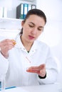 Young Female Scientist Analyzing Sample In Laboratory.laboratory assistant analyzing a sample Royalty Free Stock Photo