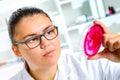 Young Female Scientist Analyzing Sample In Laboratory