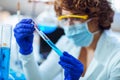 Young female scientist in protective glasses and gloves Royalty Free Stock Photo