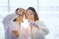 Young female scientist standing with techer in lab worker making Royalty Free Stock Photo