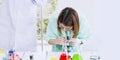 Young female scientist student looking through a microscope Royalty Free Stock Photo