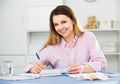 Young female is signing profitable financial agreement Royalty Free Stock Photo