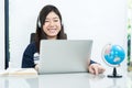 Young female sitting in living room and learning online Royalty Free Stock Photo