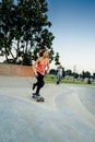 Young female skateboarder at the skatepark