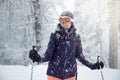 Young woman skiing under snowfall Royalty Free Stock Photo