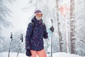 Young woman skiing under snowfall Royalty Free Stock Photo