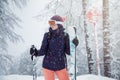 Young woman skiing under snowfall Royalty Free Stock Photo