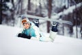 Young female snowboarder resting