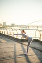 Young female sportsperson having a workout outside