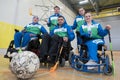 Young female sportswomen in wheelchairs prepare for competitions in the gym