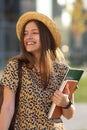 Young female student with backpack and books. Royalty Free Stock Photo