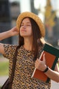 Young female student with backpack and books. Royalty Free Stock Photo