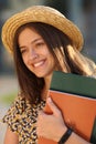 Young female student with backpack and books. Royalty Free Stock Photo